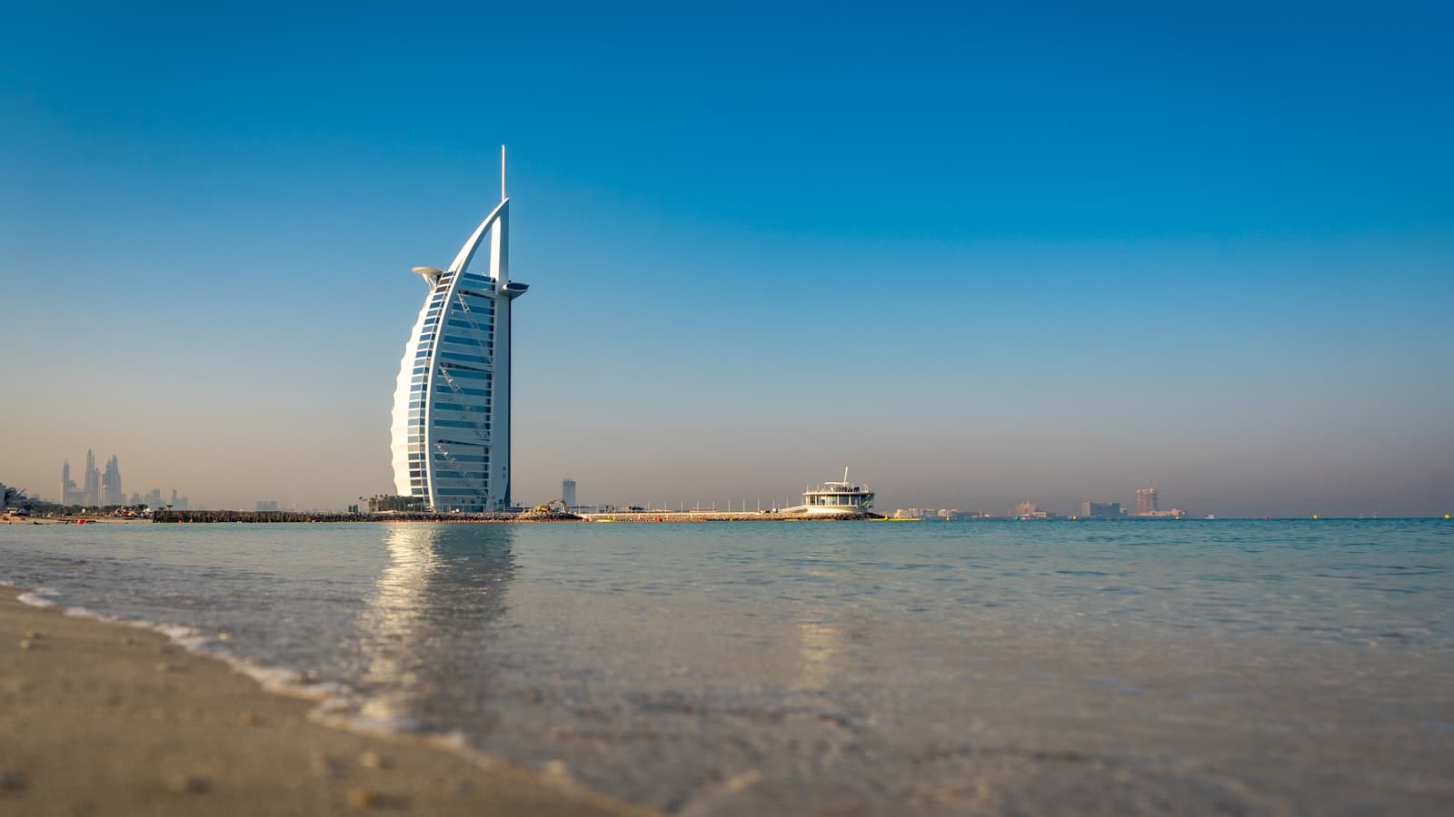 Self-drive speedboat in front of the Burj Al Arab at golden hour
